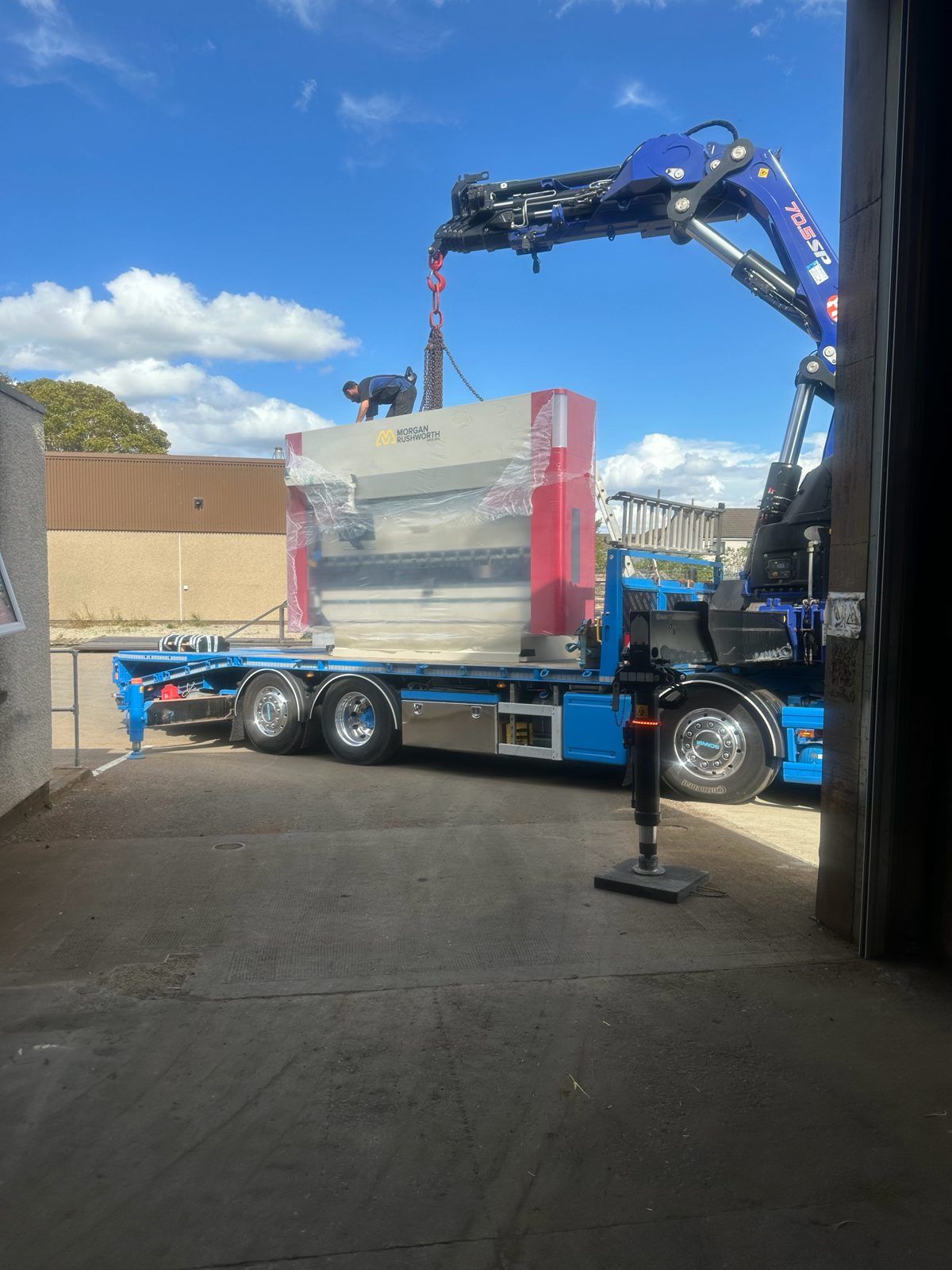 New Morgan Rushworth CNC press brake being craned off a lorry outside the Sellar Engineering workshop